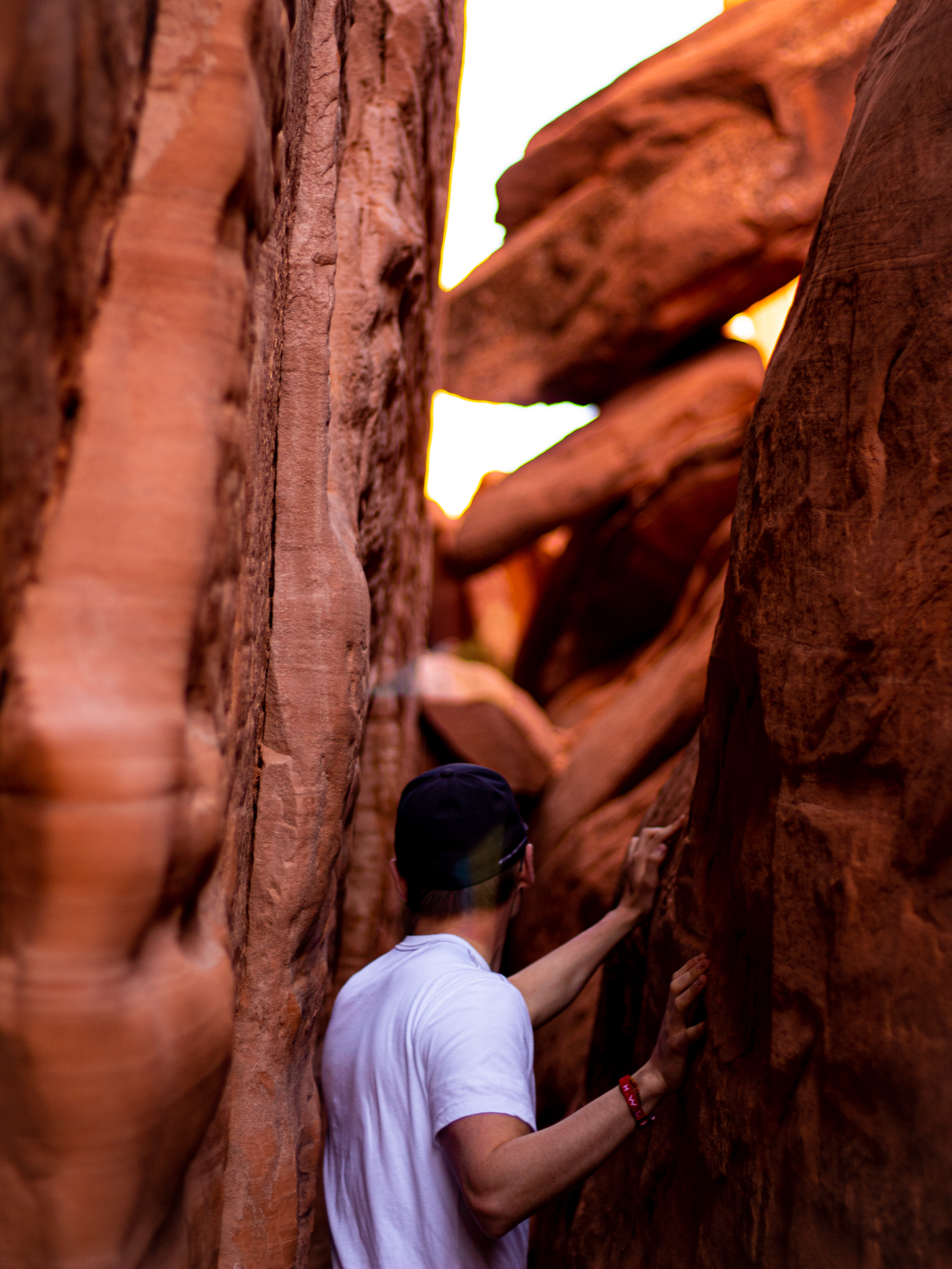 Quinn surrounded by rocks as he adventures through a canyon