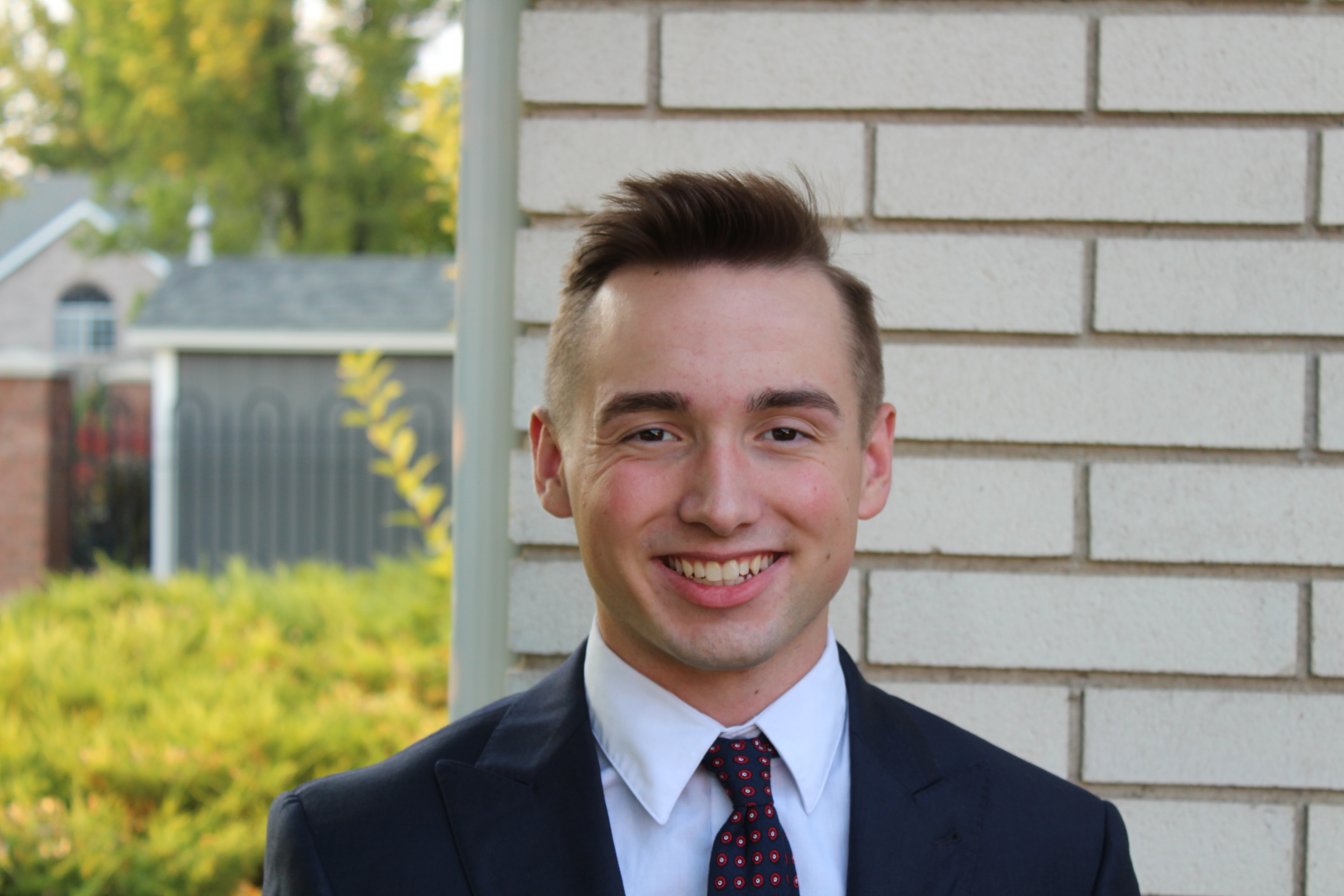 Quinn younger and before his mission in a really good looking headdshot